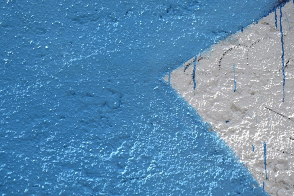 a close up of a blue and white wall